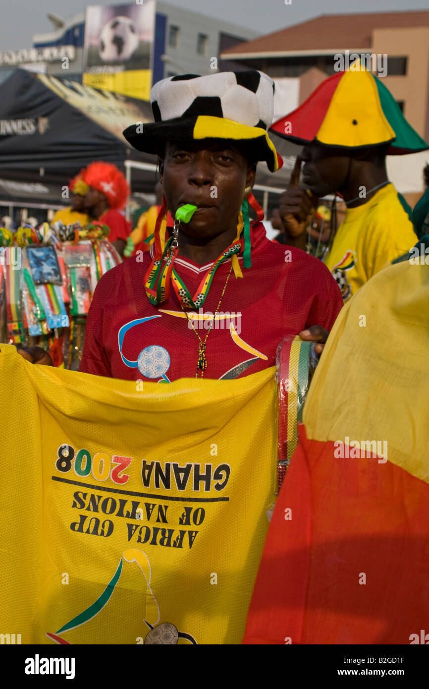Man selling flags and souvenirs of Africa Cup of Nations 2008 Accra Stock Photo