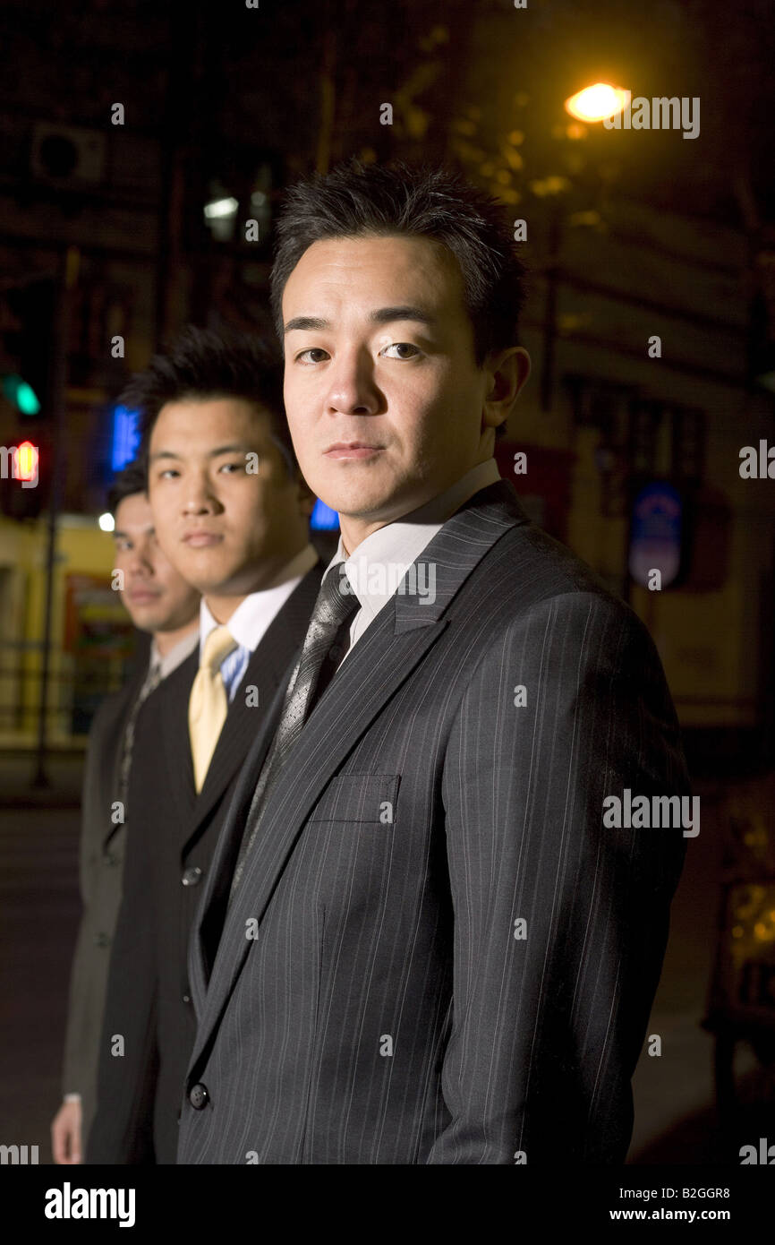 Portrait of businessmen standing in a row Stock Photo - Alamy