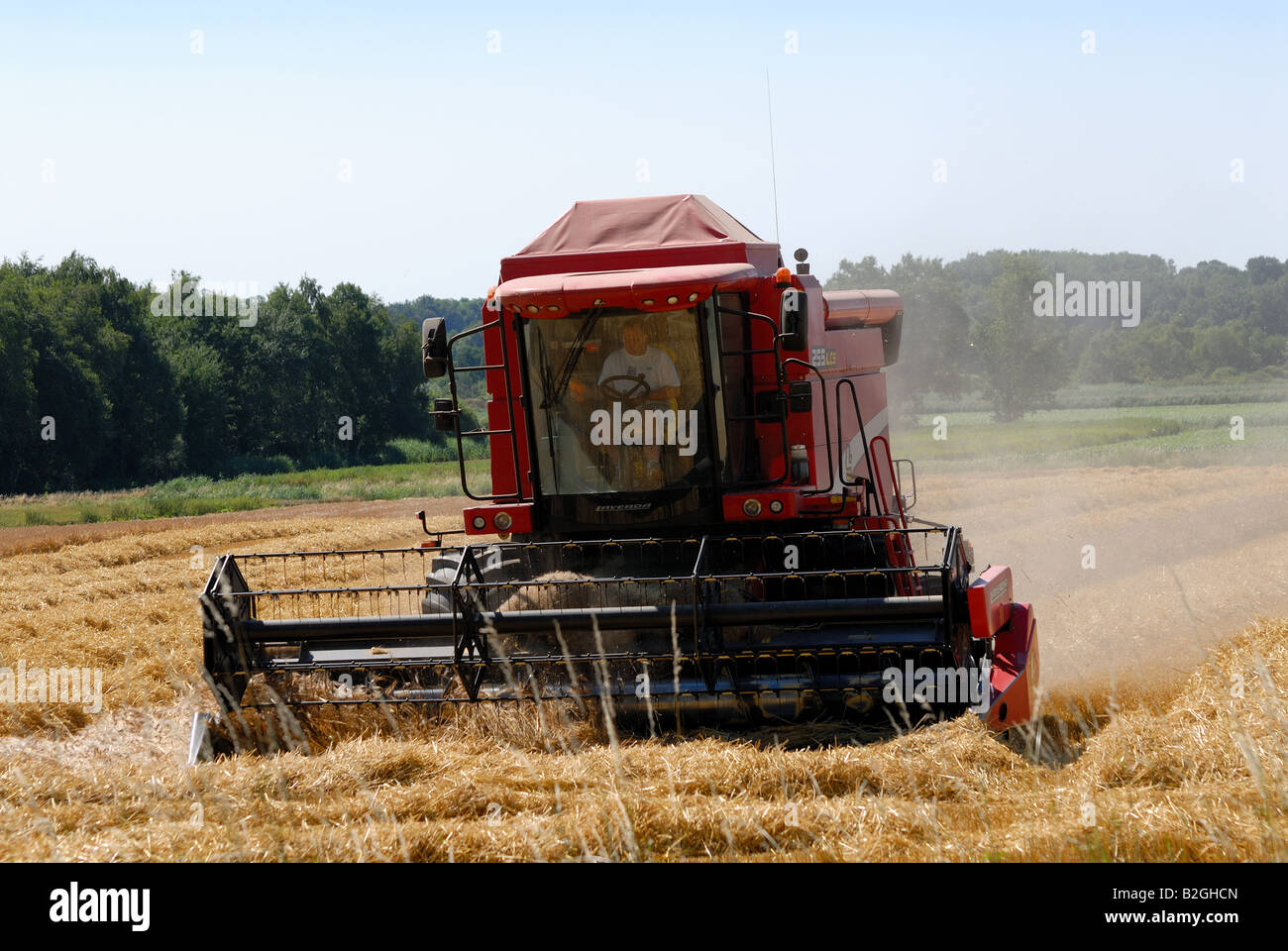 Combine harvester in the field Stock Photo - Alamy