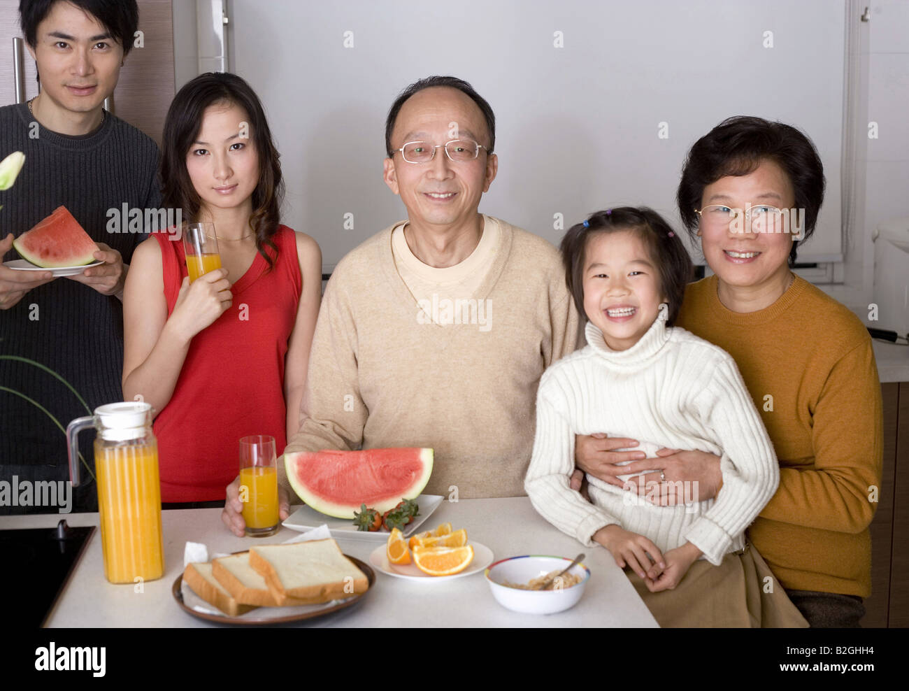 Portrait of a family at a breakfast table Stock Photo - Alamy