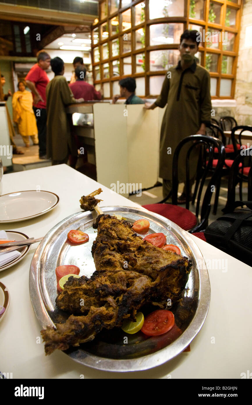 A leg of lamb is served at a restaurant in the Chandni Chowk area of