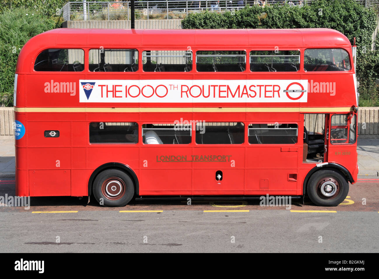 Part of London Transport historical heritage a classic red Double decker London AEC Routemaster with poster commemorating the 1000th bus England UK Stock Photo