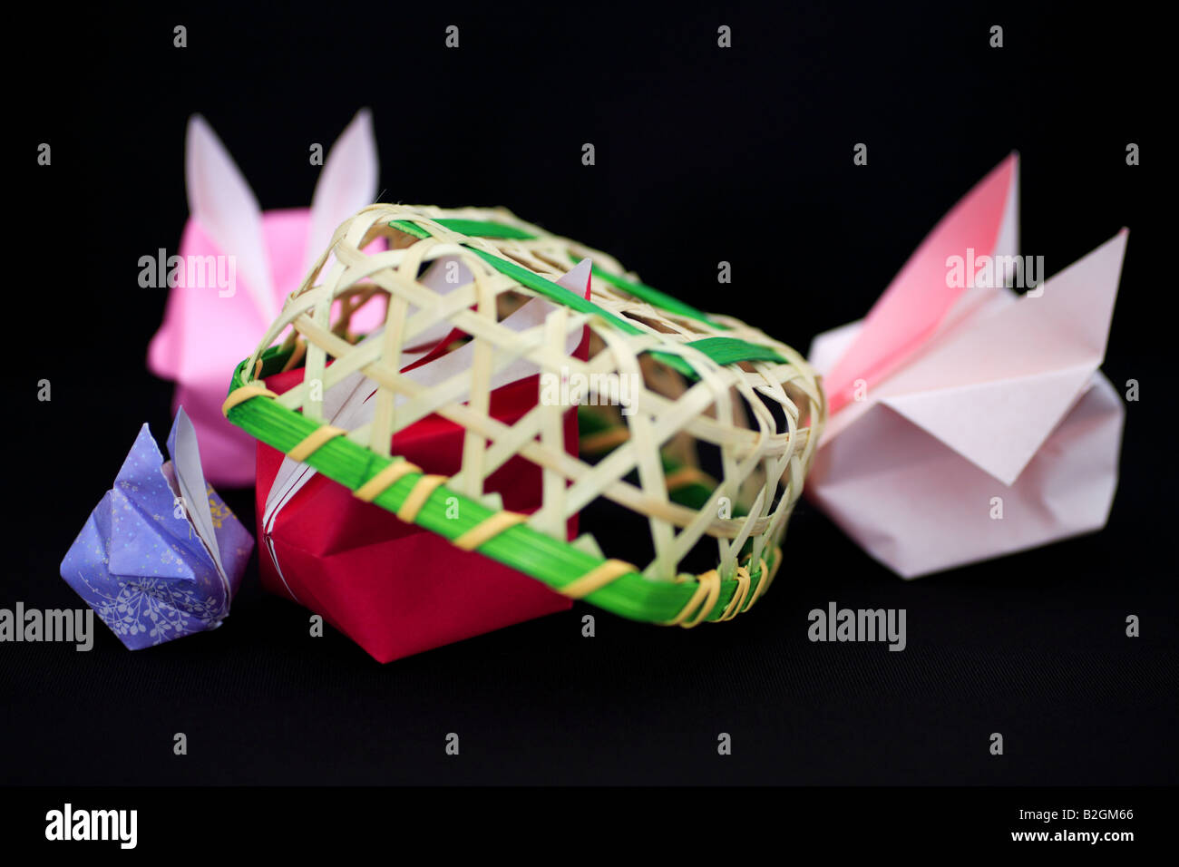 Origami rabbits and a basket Stock Photo - Alamy