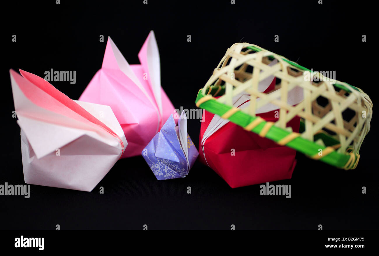 Origami rabbits and a basket Stock Photo - Alamy