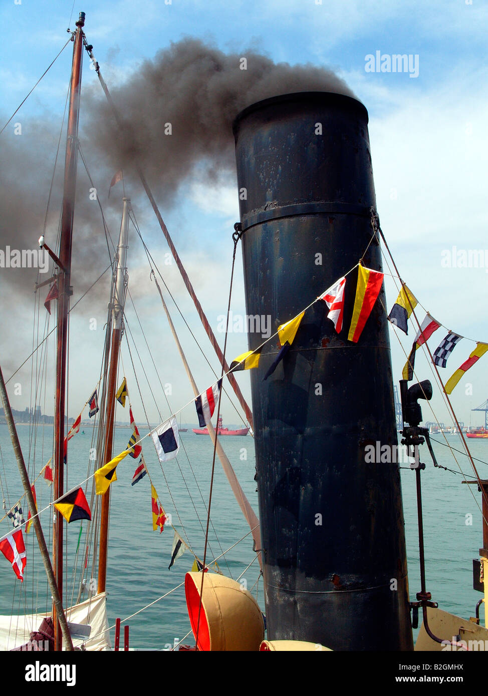 Smoking boat funnel Stock Photo - Alamy