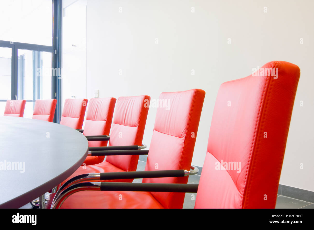 Red Leather Chairs In A Conference Room Stock Photo Alamy