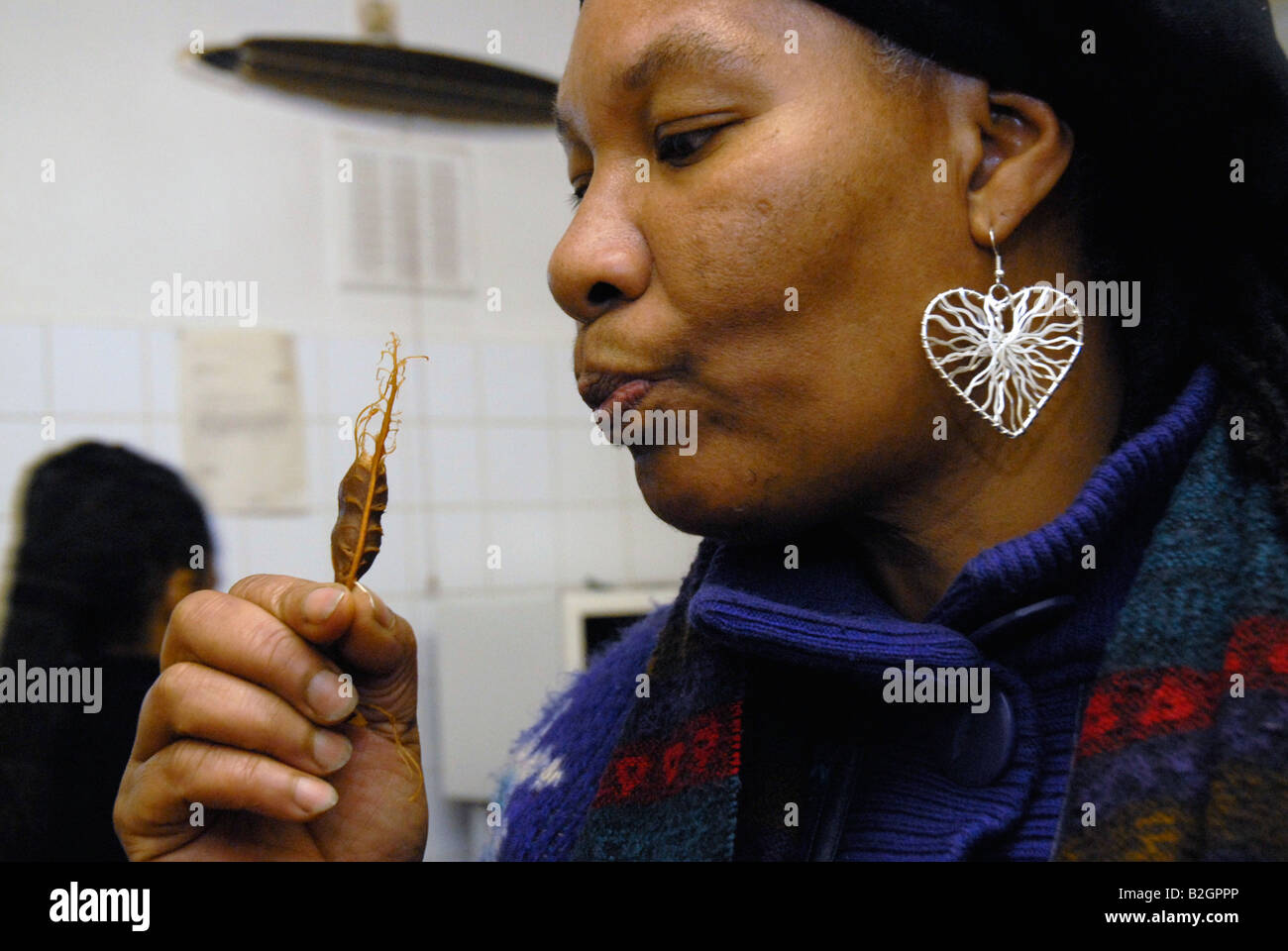 Woman eating tamarind Stock Photo Alamy