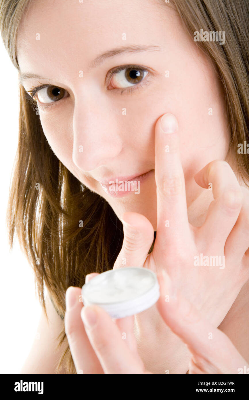 portrait woman facial skincare put on some lotion cosmetic skin care beauty care skincare wellness body lotion facial skincare Stock Photo