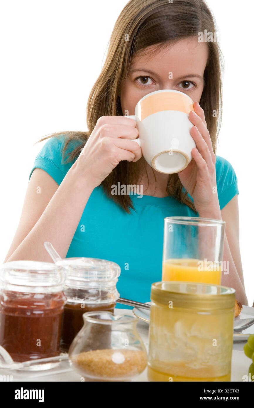 coffee young woman breakfast juice fruits healthful eating sound food morning bananas apples grapes body care wellness people Stock Photo