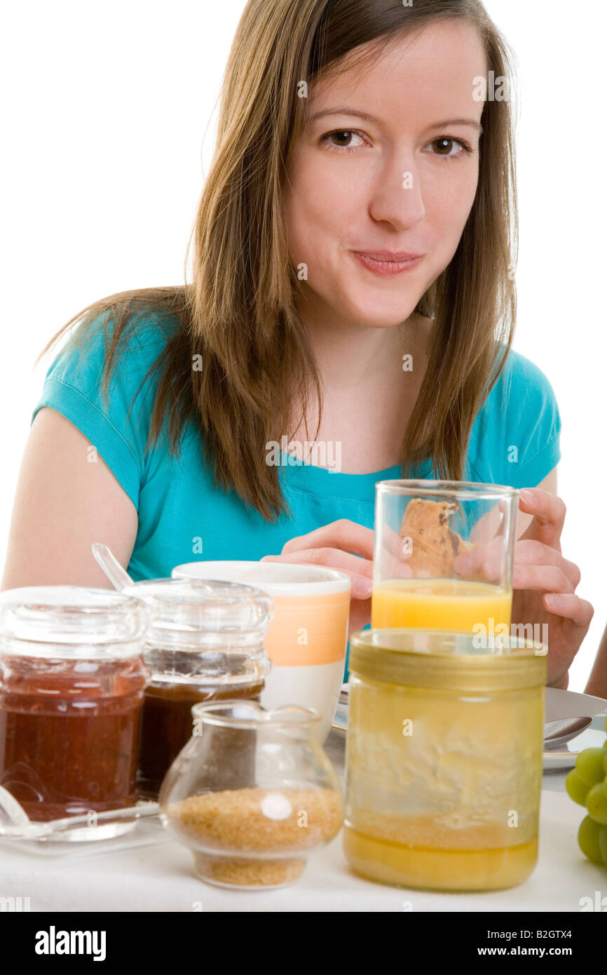 young woman breakfast juice fruits healthful eating sound food morning bananas apples grapes body care wellness people Stock Photo