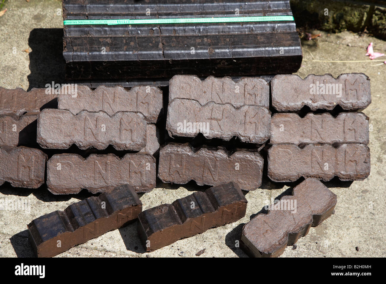 Peat Briquettes (bord na mona) Stacked and ready to be burnt Stock Photo