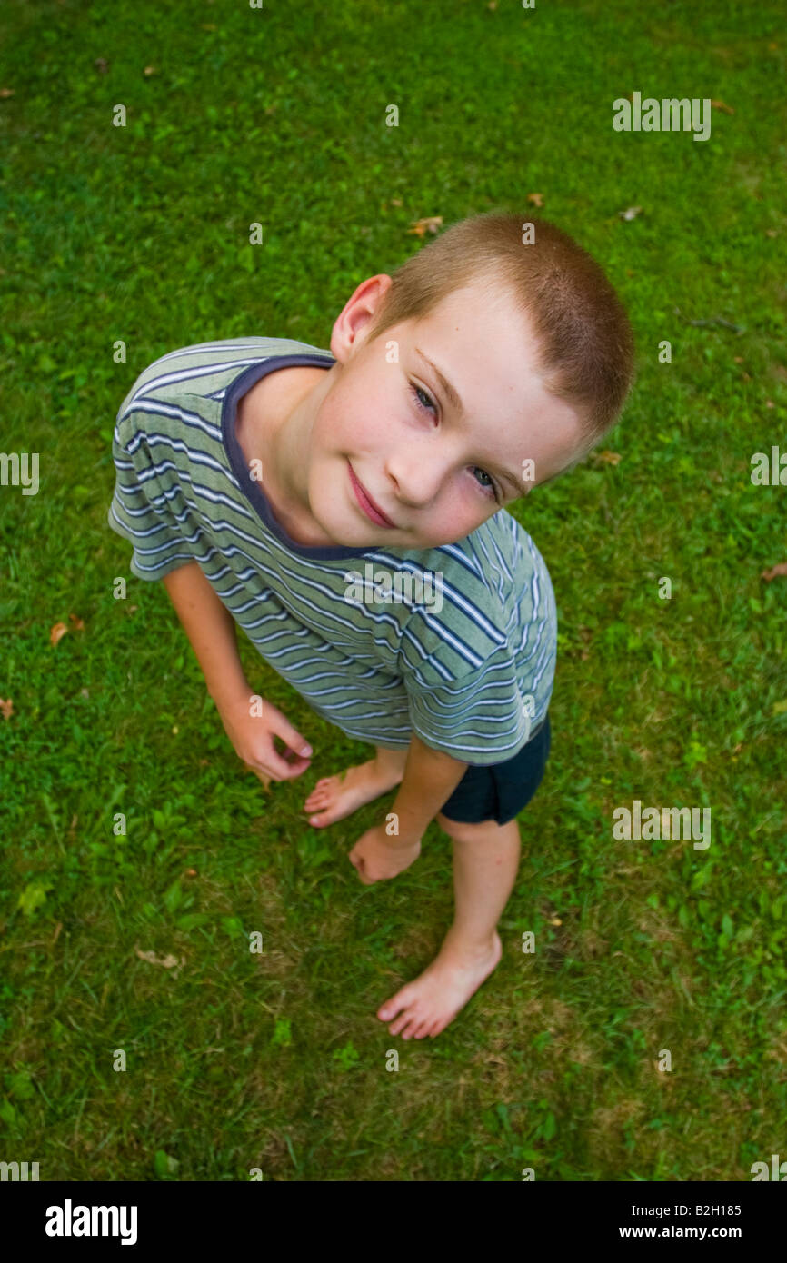 Young boy looking up at the camera Model Released Stock Photo - Alamy