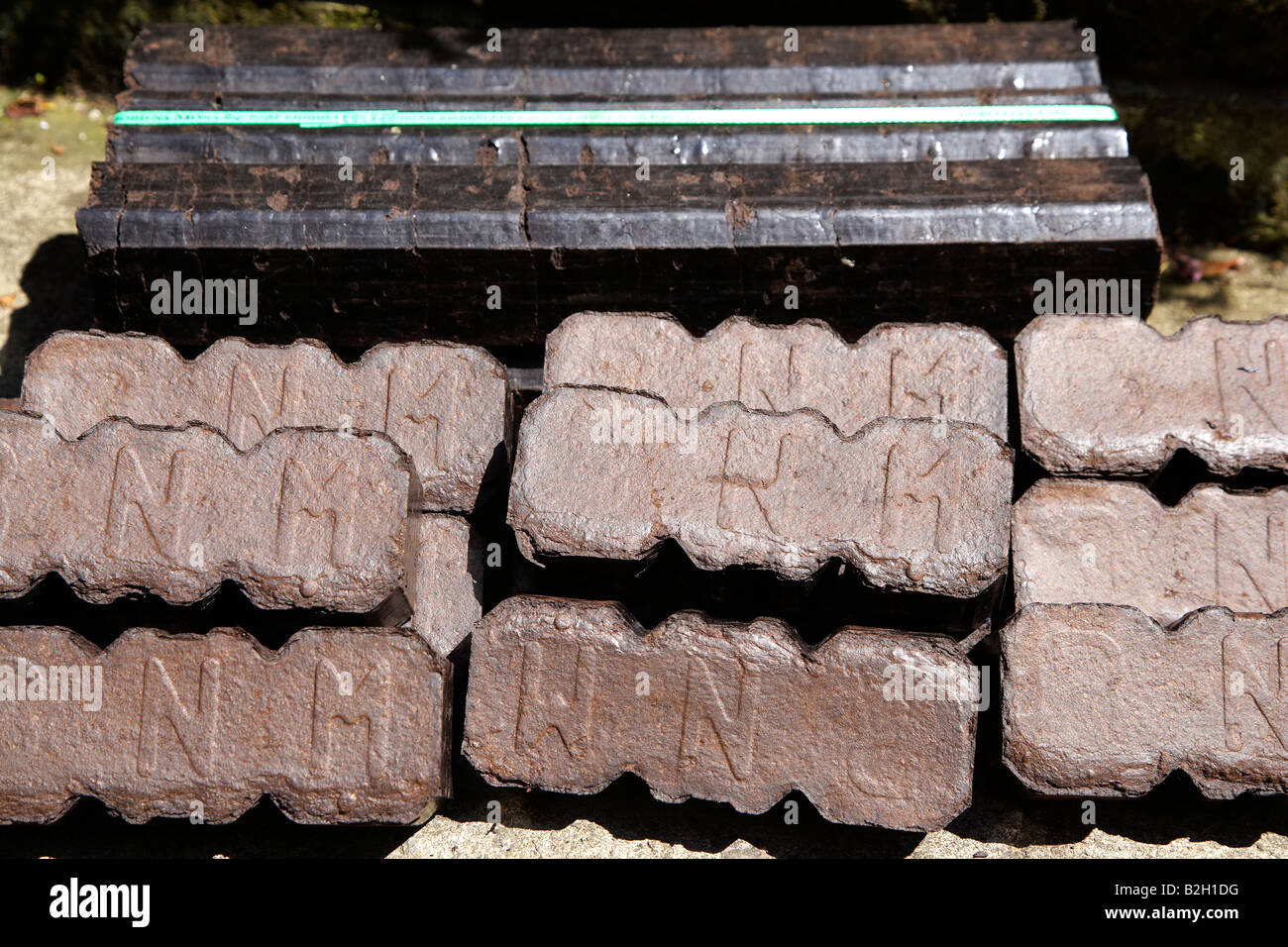 Peat Briquettes (bord na mona) Stacked and ready to be burnt Stock Photo