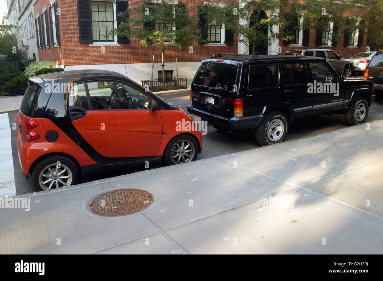 A two seat Smart car manufactured by Mercedes Benz is seen parked on an Upper East Side street in New York Stock Photo