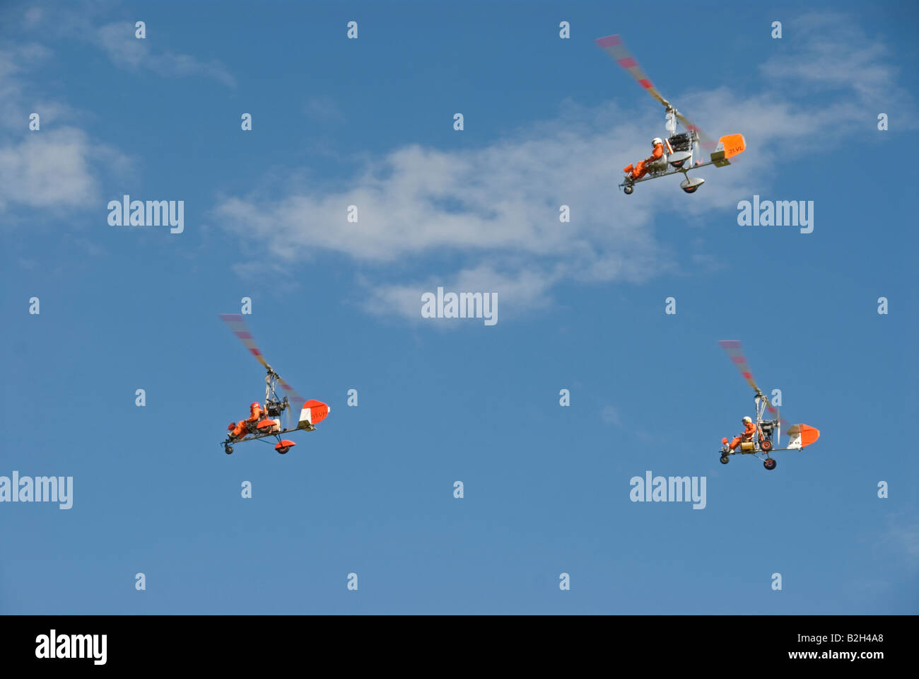 Stock photo three autogyro s flying in formation during a display in Estivol in France Stock Photo
