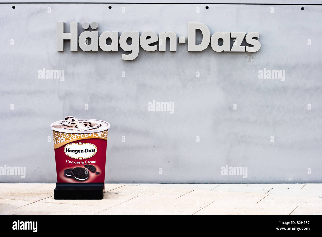 Haagen Dazs Ice Cream advertising in front of a shop in the port of Hamburg Germany Stock Photo
