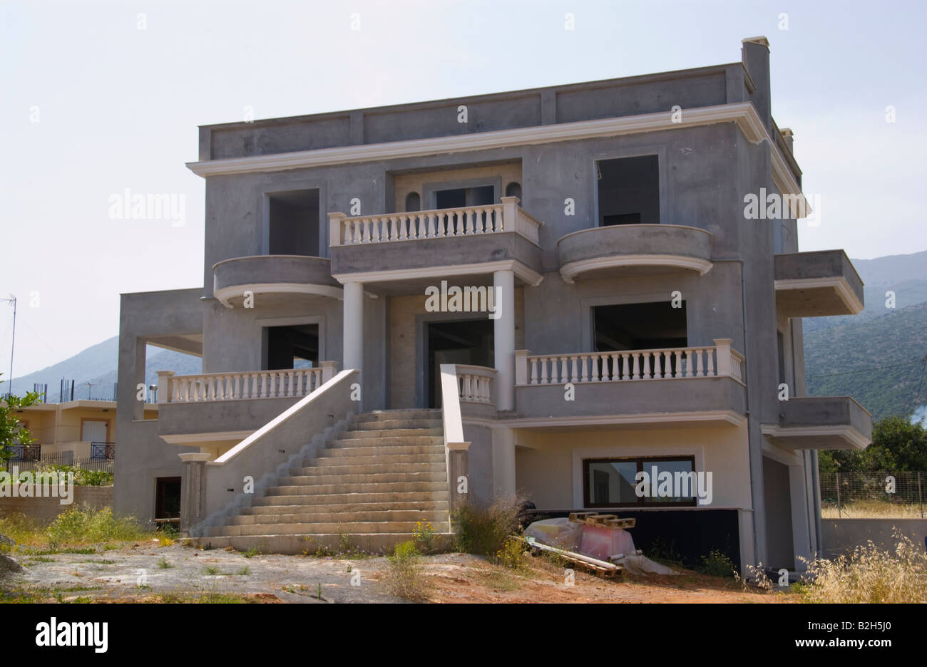 Exterior of holiday apartments under construction in Malia Old Town on the Greek Mediterranean island of Crete GR EU Stock Photo