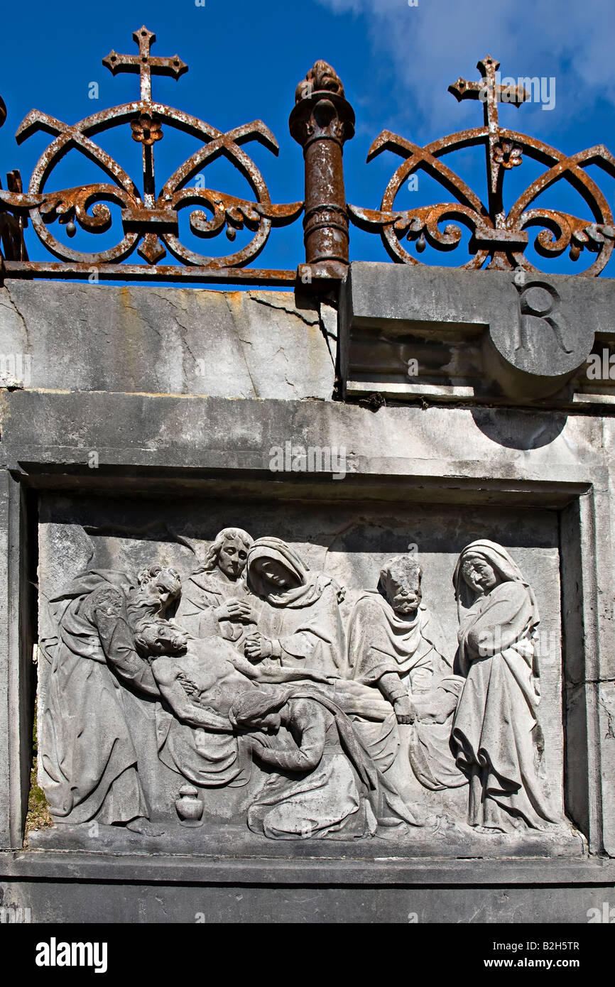Frieze Railing Frieze of dying man surrounding by people on tomb with iron crosses in ...