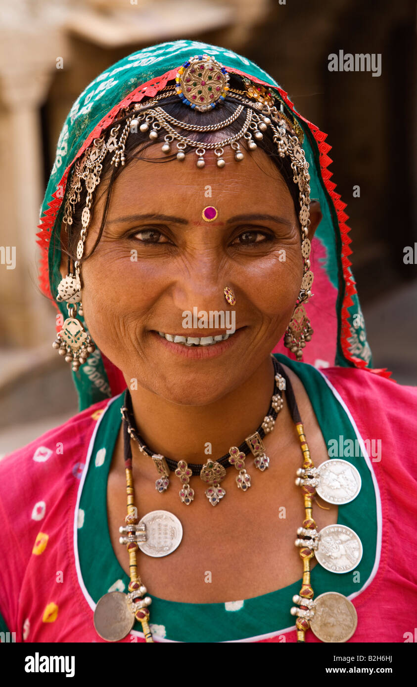 A Rajasthani woman in traditional dress including a COIN NECKLACE JAISALMER RAJASTHAN INDIA Stock Photo