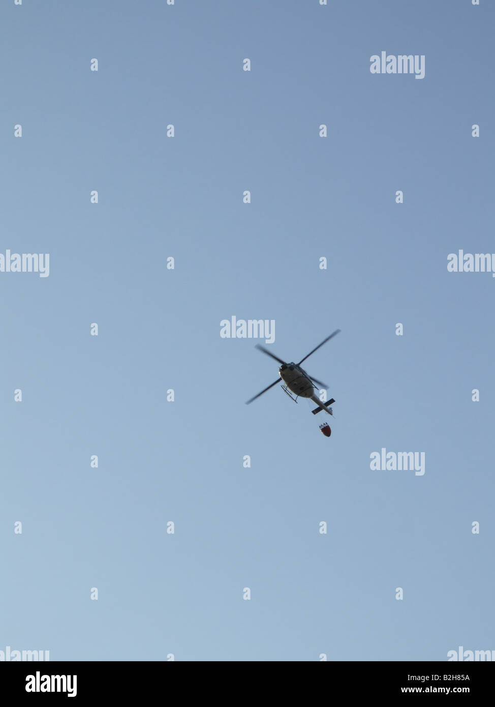 fire brigade helicopter carrying water Stock Photo Alamy