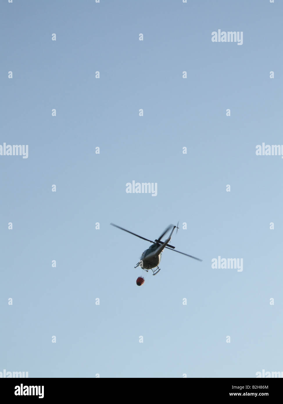 fire brigade helicopter carrying water Stock Photo Alamy