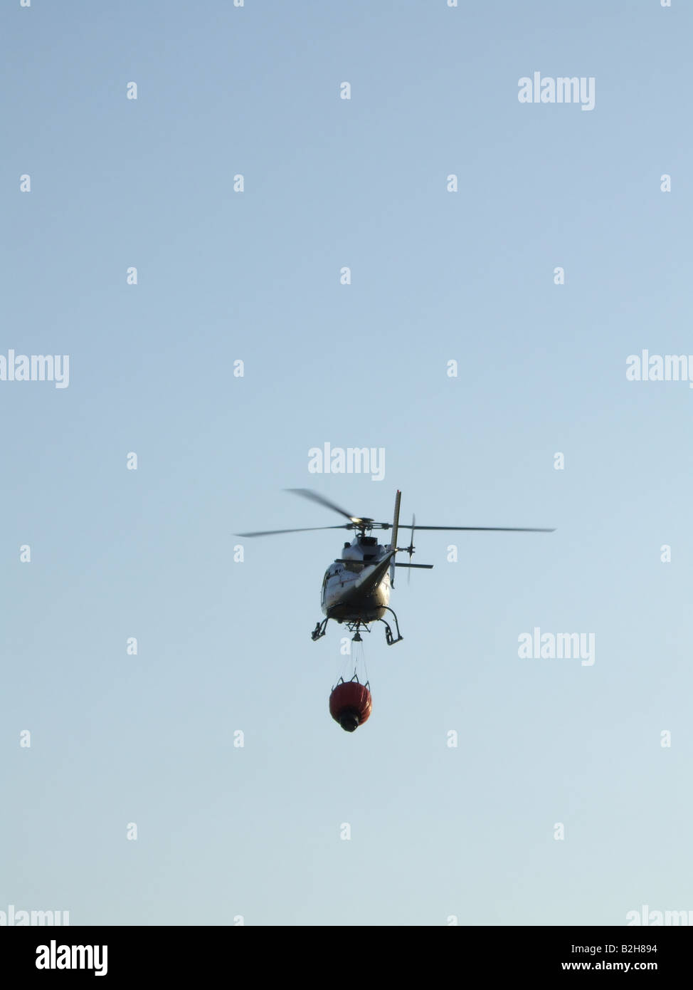 fire brigade helicopter carrying water Stock Photo Alamy
