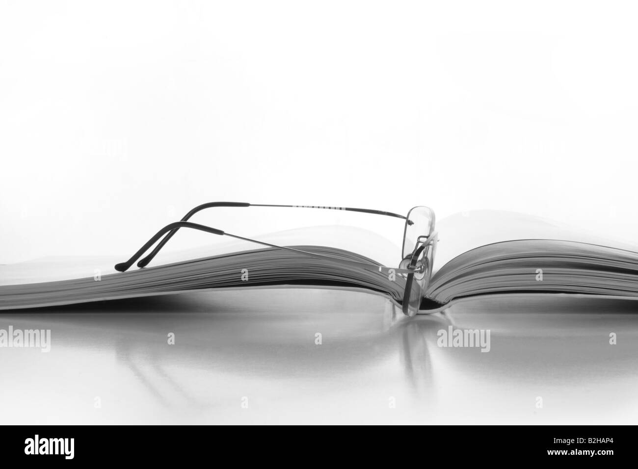 Close up of the book with glasses Stock Photo