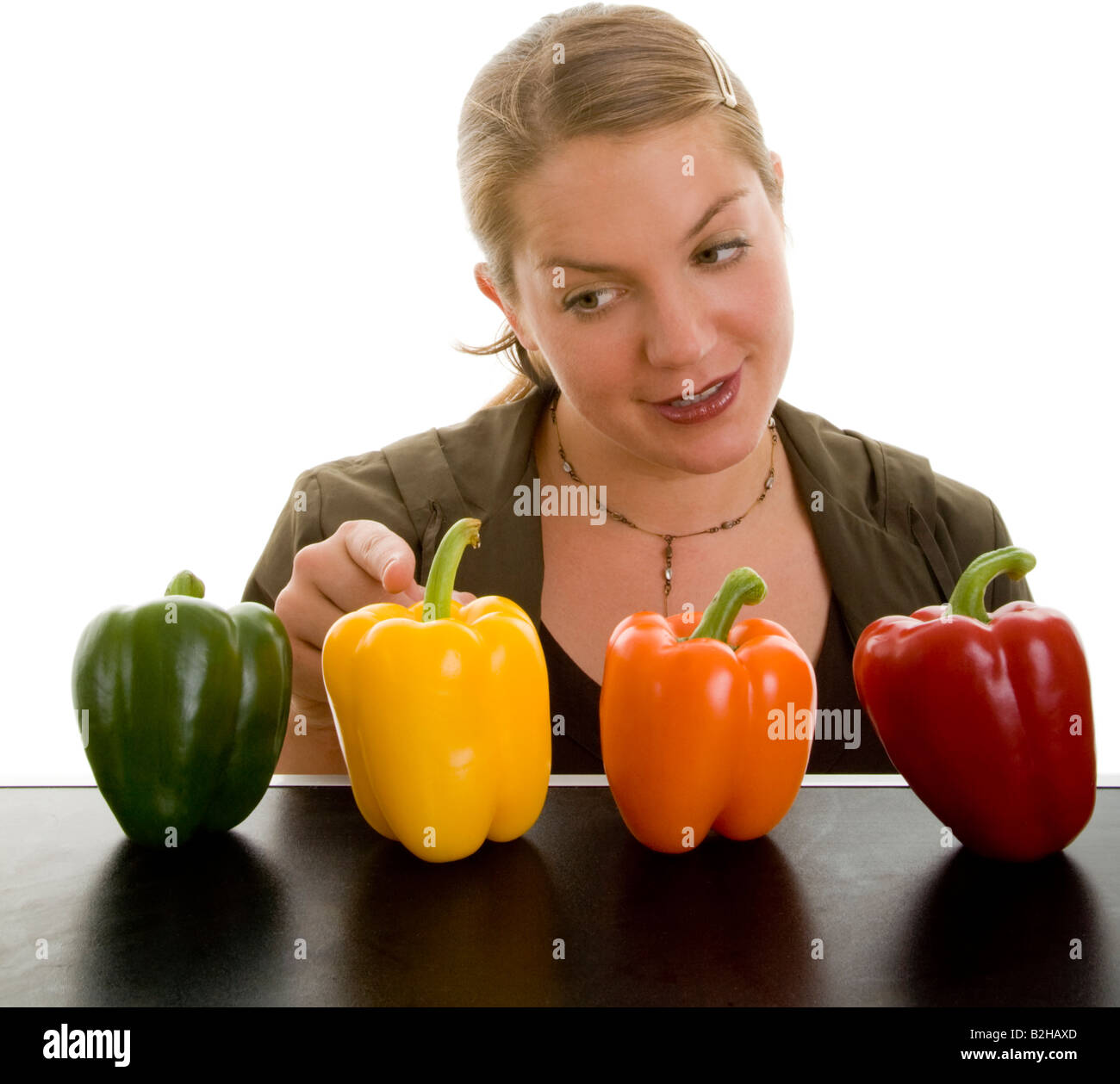 sweet peppers bell peppers greenstuff vegetable veggie vegetables vegetarian food woman Stock Photo