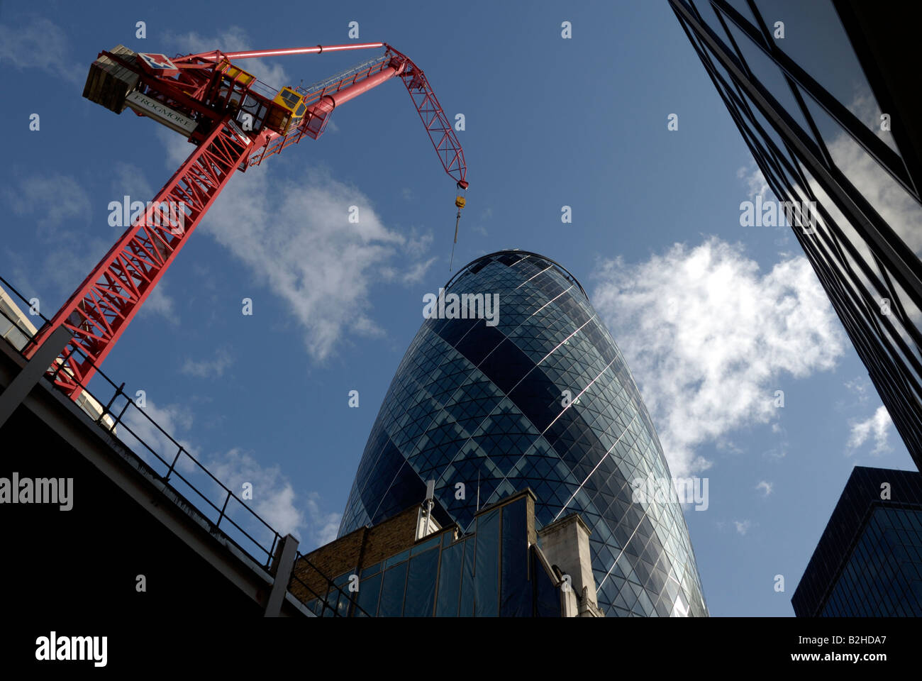Crane at work near “Norman Foster”s Gherkin building Stock Photo