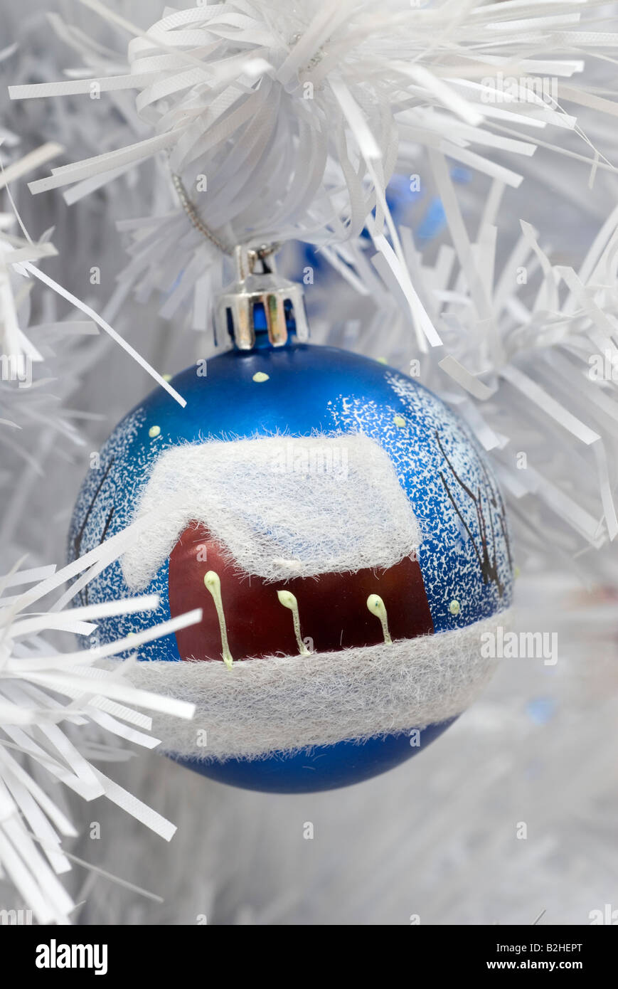 painted bauble hanging on christmas tree Stock Photo