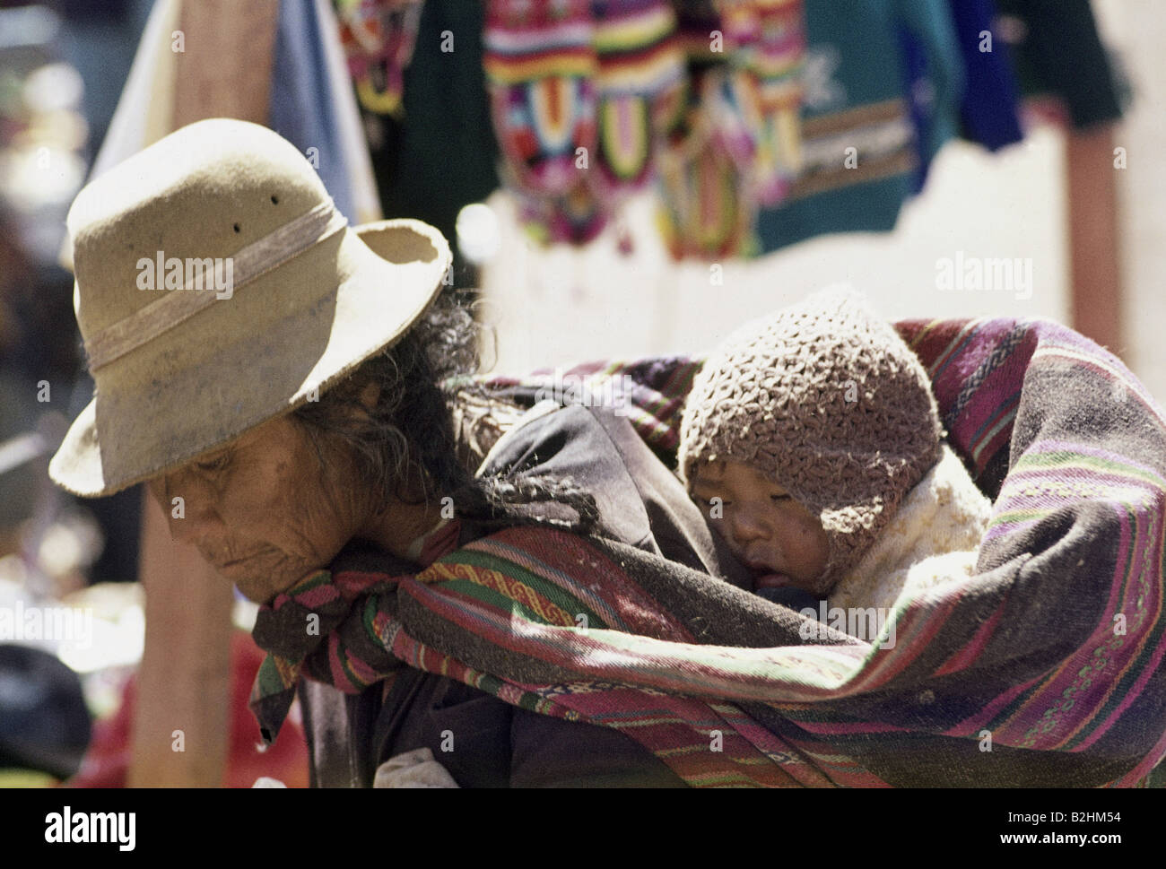 people, women with children, Peru, indigenous woman with child, Puno, Peru, mother, infant, baby, hat, baby-sling, carry-sling, Stock Photo