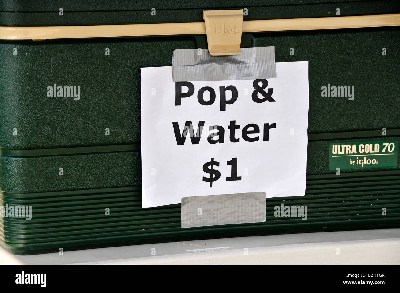 Pop and water for 1 dollar on the side of a cooler Stock Photo