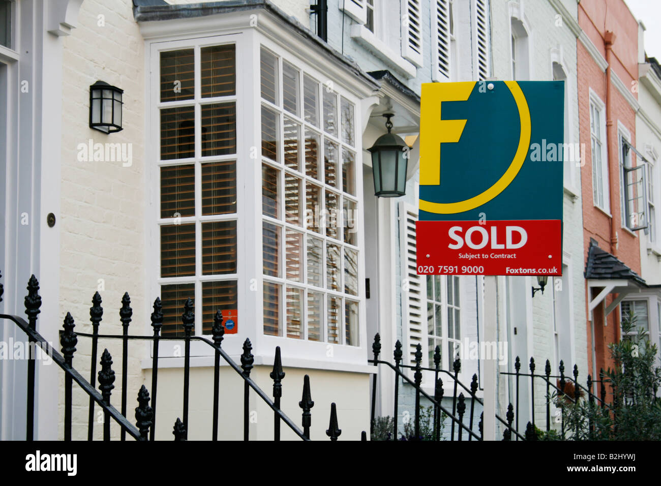 White Kensington house with Sold sign Stock Photo