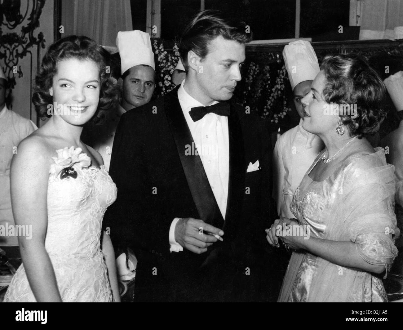 Schneider, Romy, 23.9.1938 - 29.5.1982, German actress, half length, with Karlheinz Böhm and her mother Magda Schneider, at a reception, 1950s, Stock Photo