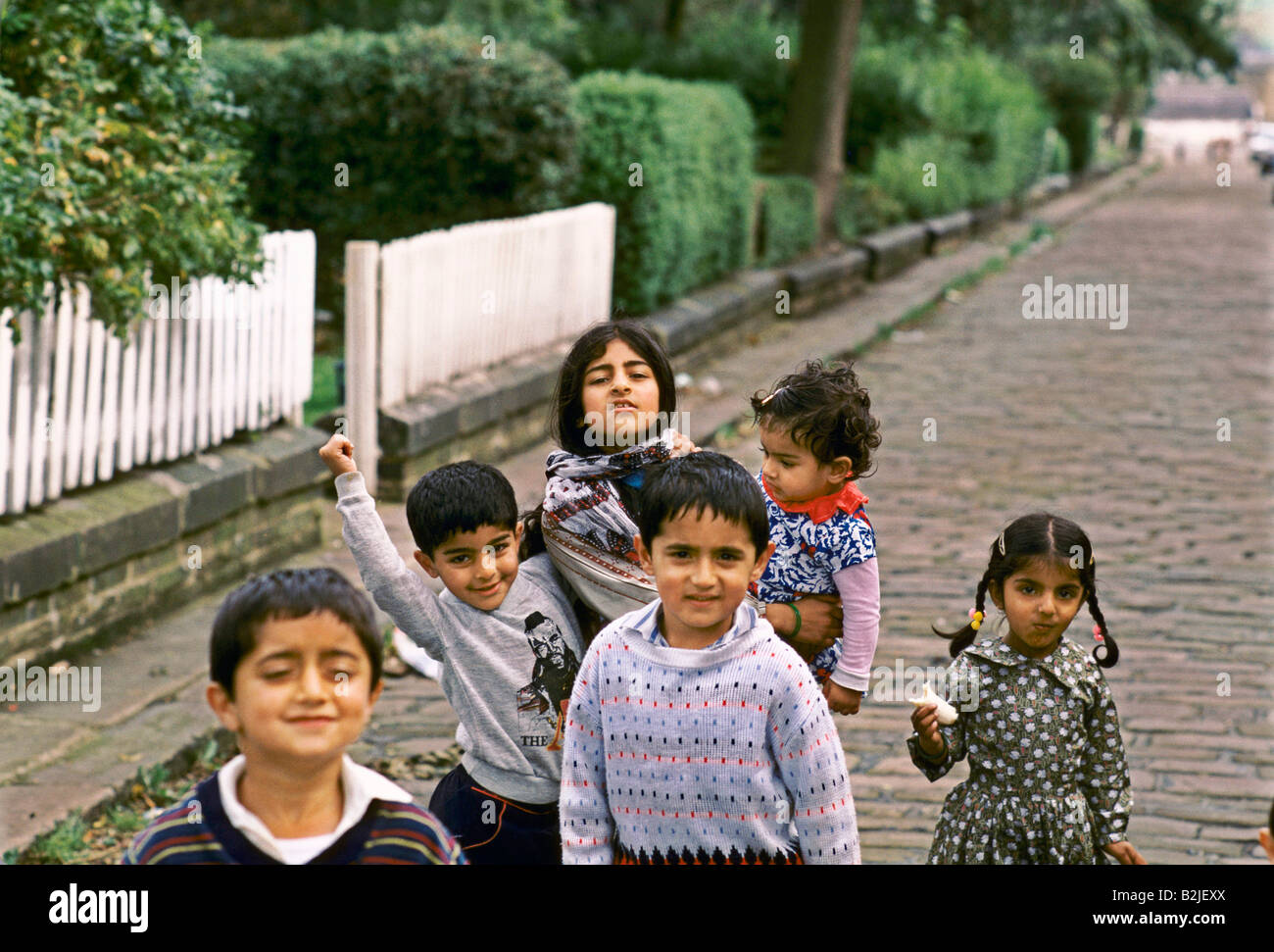 asian children playing on the street in bradford Stock Photo