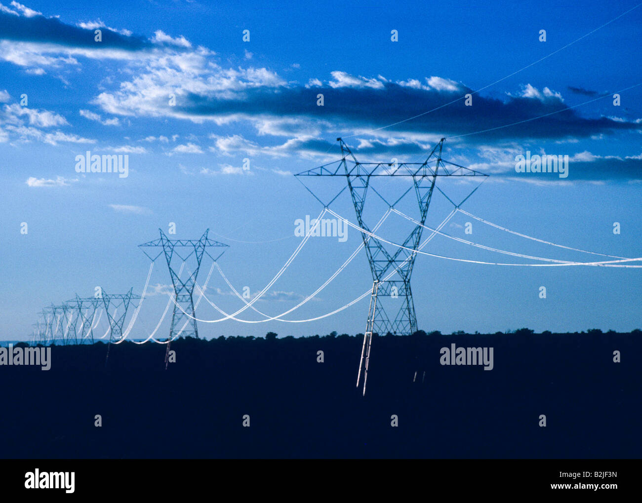 High voltage electric power transmission lines shine Stock Photo Alamy