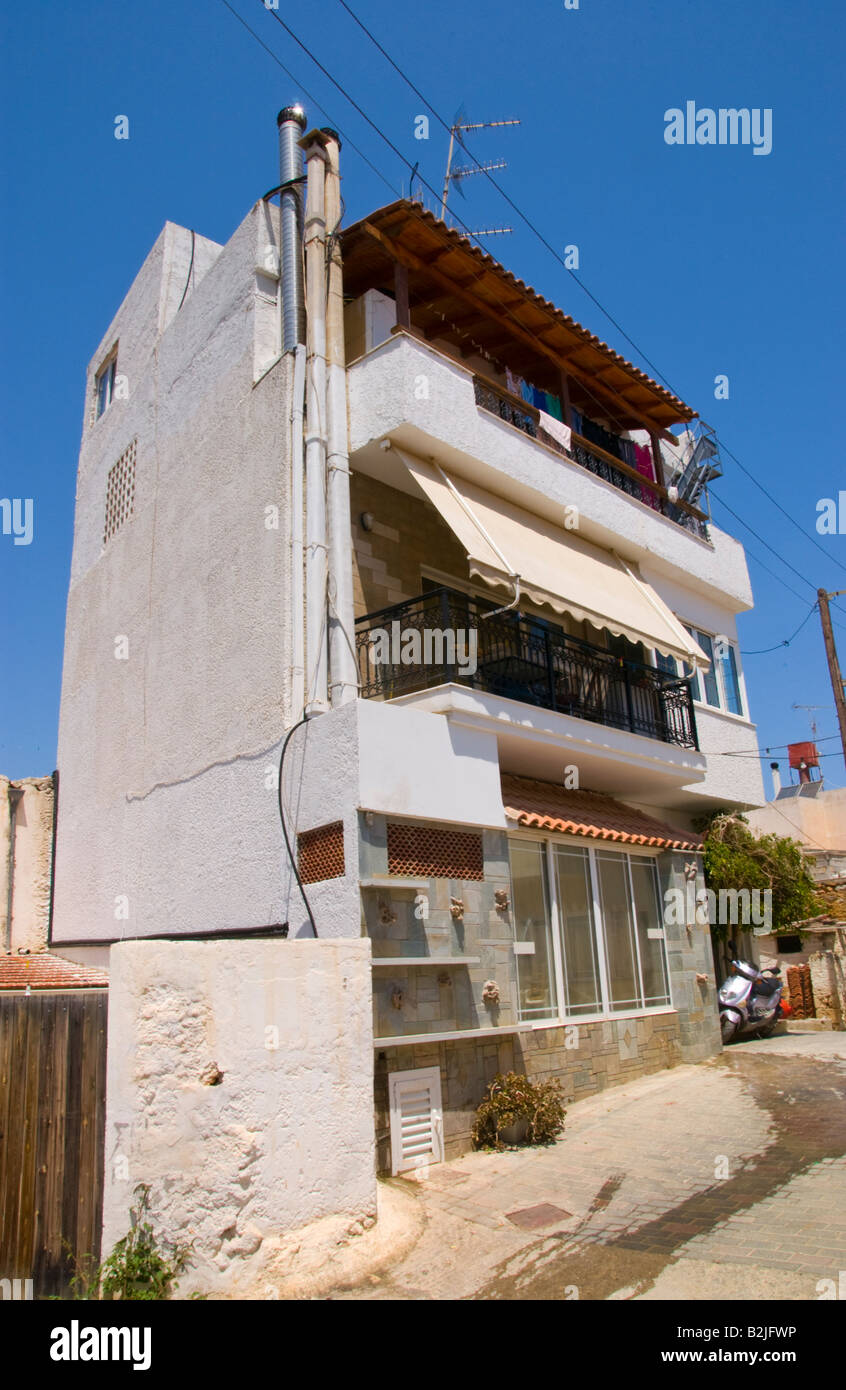 Three story house on narrow street in Malia Old Town on the Greek Mediterranean island of Crete GR EU Stock Photo