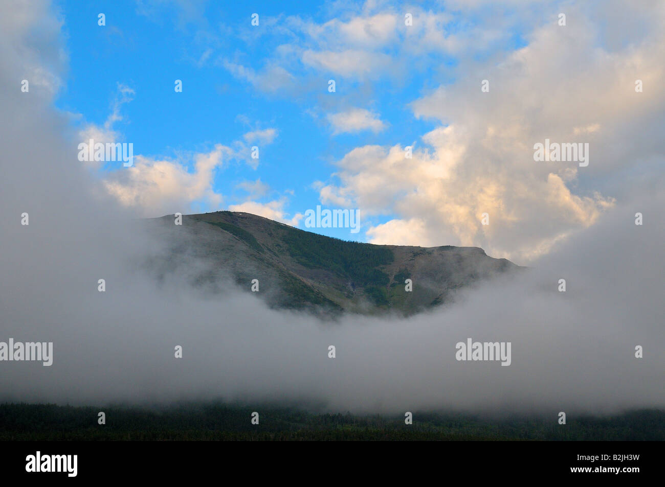 Mist Between Two Ridges Mist around a mountain ridge Stock Photo - Alamy