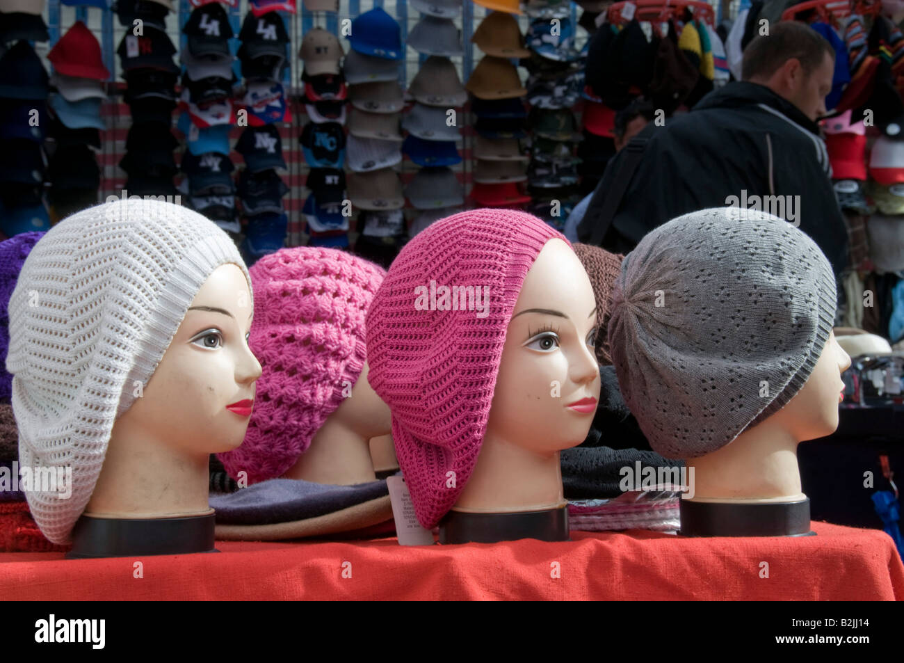 Row of mannequins wearing woolly hats Stock Photo Alamy