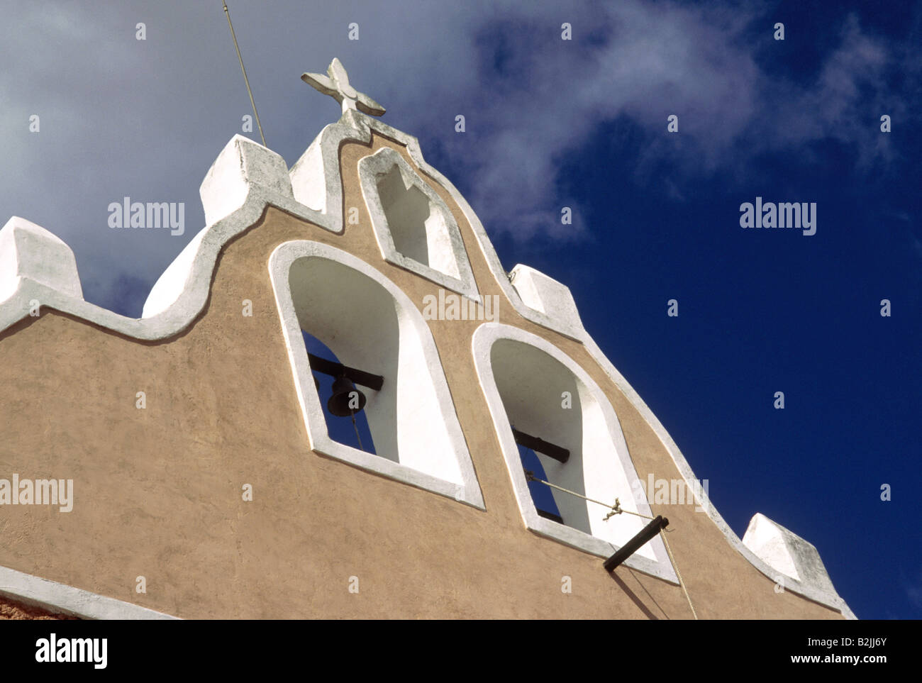 Historic building Church Bell tower Painted plaster white edging Bell VALLADOLID YUCATAN MEXICO Stock Photo