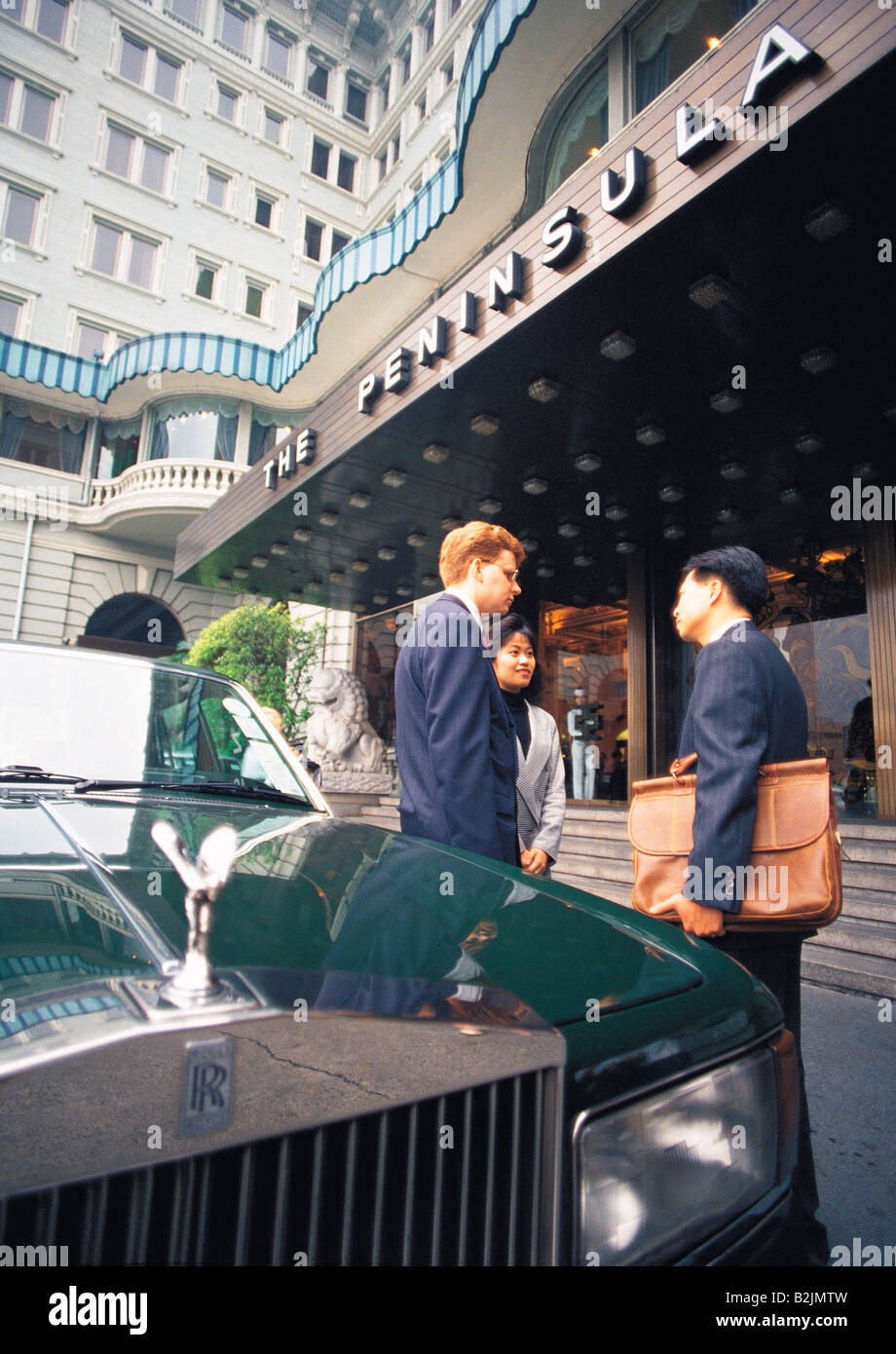 Hong Kong. Rolls Royce motor car outside the Peninsula hotel. Young