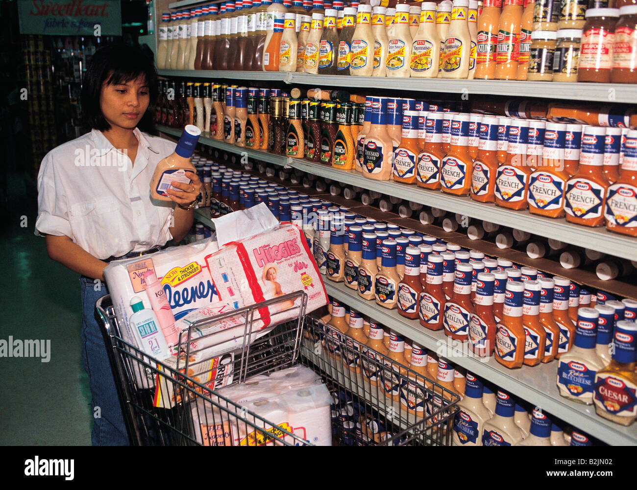 Woman shopping in supermarket Stock Photo