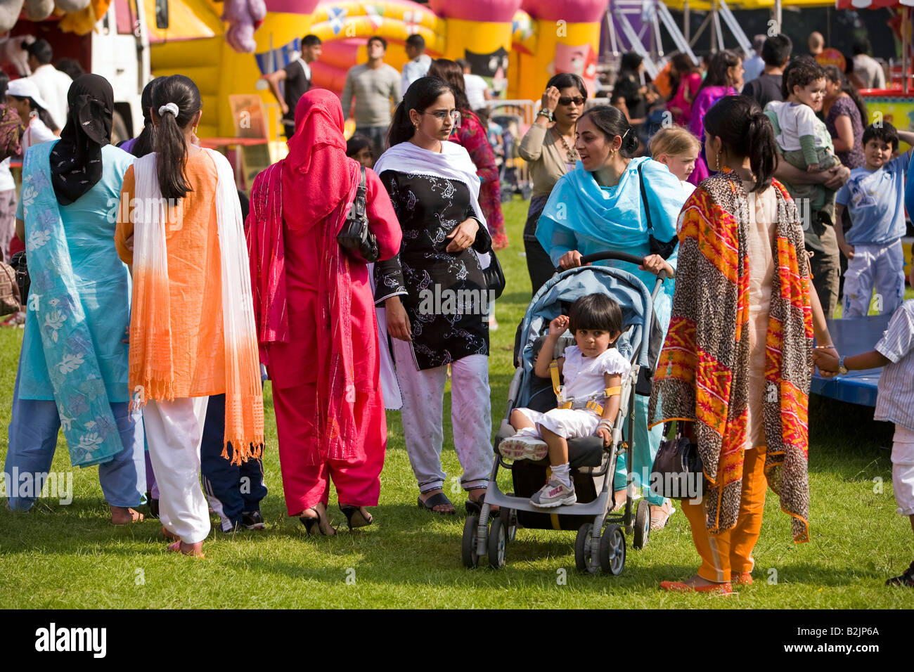 UK England Manchester Platt Fields Mega Mela shalwar kameez wearing Pakistani women visitors Stock Photo