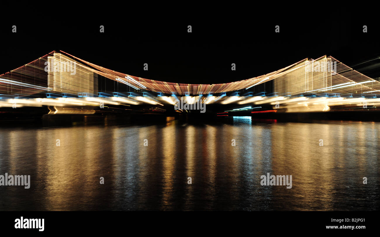 Chelsea Bridge night view in London with zoom effect achieved with the ...