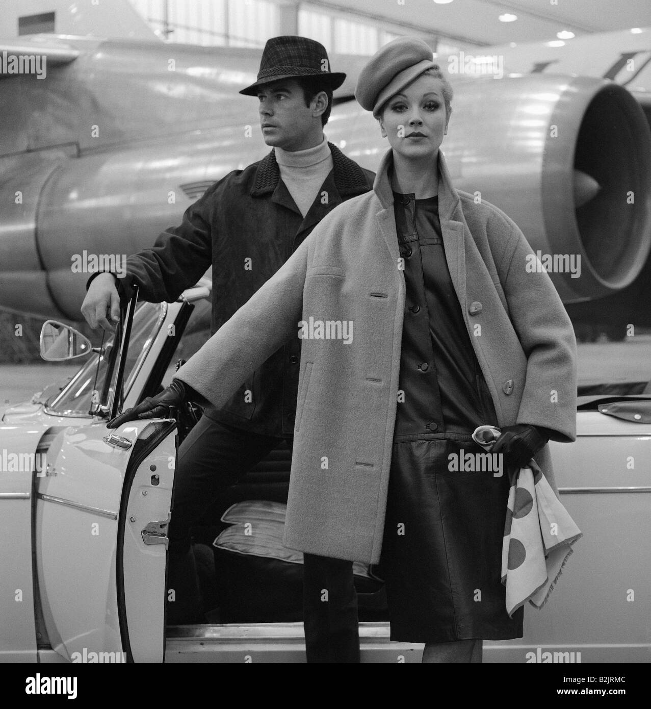 fashion, 1960s, model at car, Lufthansa hangar, photographer: Rico Puhlmann, Additional-Rights-Clearance-Info-Not-Available Stock Photo