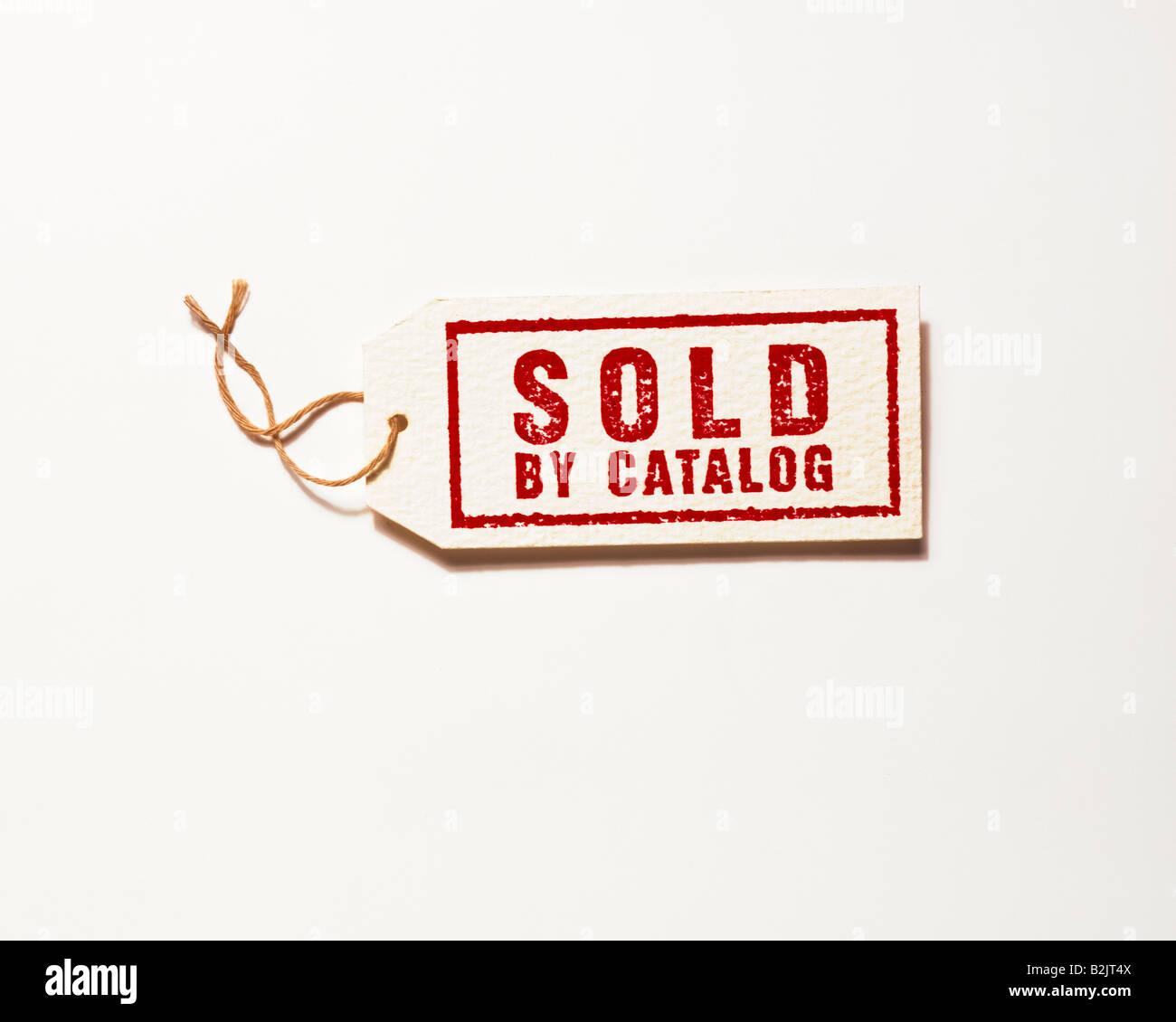 retail merchandise for sale ticket tags saying SOLD by catalog on white