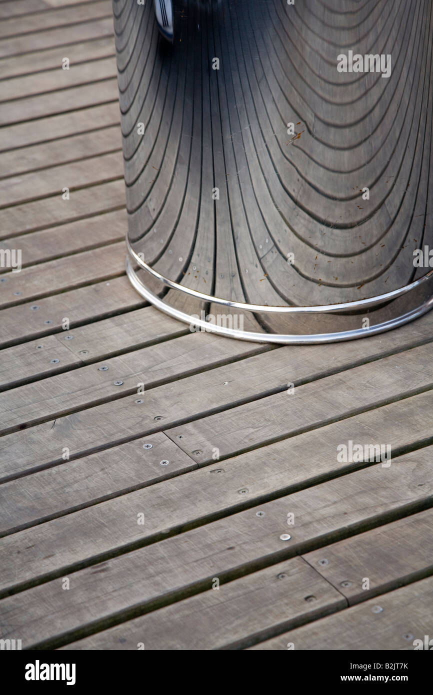 Silver dustbin on wooden decking in a Juan Valdez coffee shop in Colombia Stock Photo