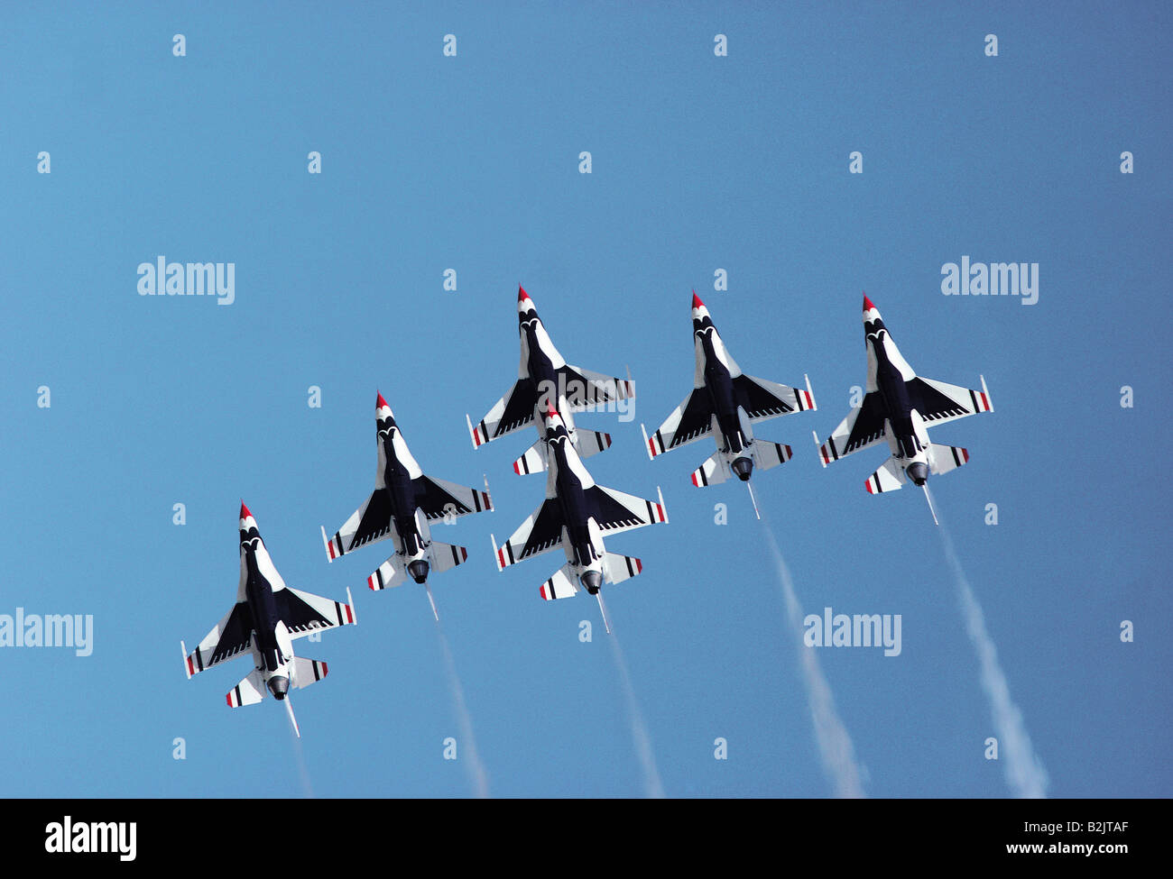 Low angle view of USAF Thunderbirds team F-16s squadron in delta formation. Stock Photo