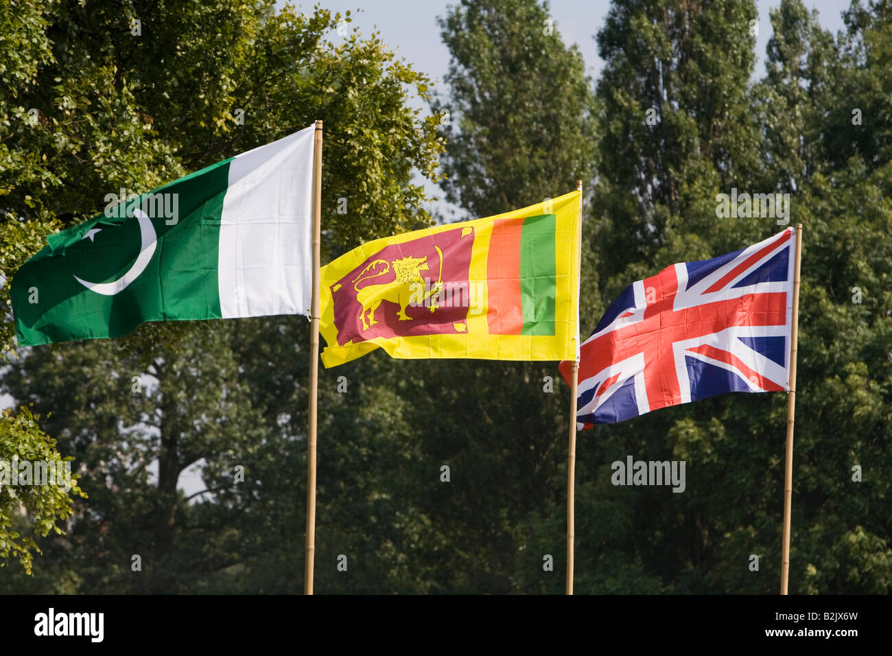 UK England Manchester Platt Fields Mega Mela Pakistani Sri Lankan and British flags flying together Stock Photo