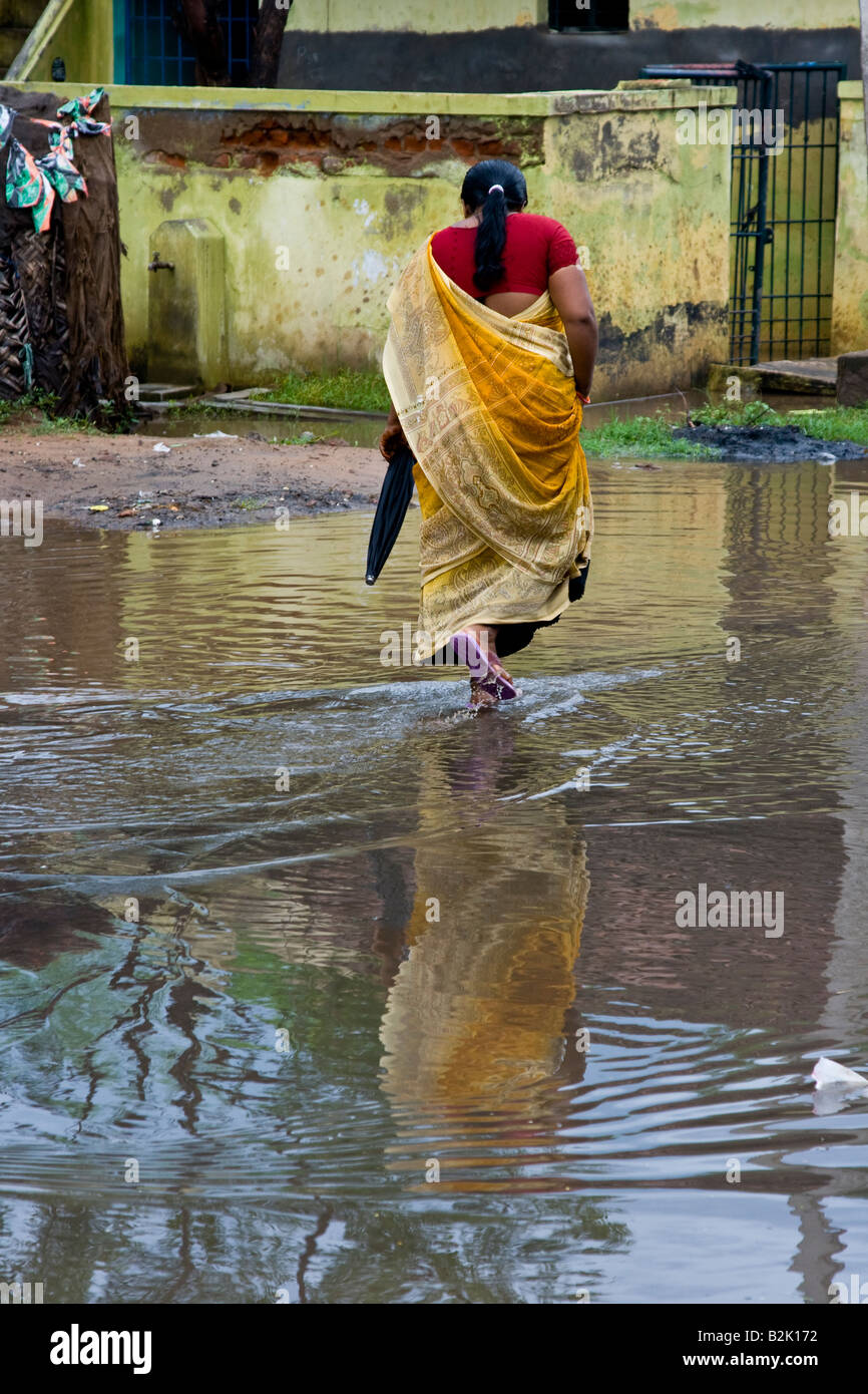 Walking through Flooded Street in Darasuram South India Stock Photo